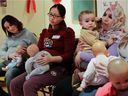 Expectant mothers, from the left, Assia Boukacem, Shanshan Mi and Zineb Abdallah-Hadj (with her son Mohamed-Amine) attend a breast-feeding class  at the Montreal Diet Dispensary in Montreal Tuesday, December 2, 2014. 