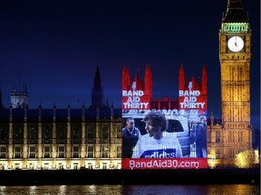 Band Aid 30 is projected onto the The Palace of Westminster on December 7, 2014 in London, England. Band Aid 30 is a charity project set by Bob Geldof and Midge Ure to raise money to combat the ebola epidemic in West Africa.