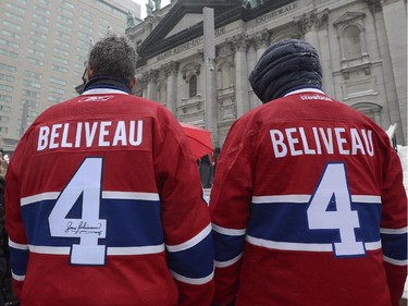 Fans wait outside Montreal Cathedral before the funeral for former Montreal Canadiens captain Jean Béliveau in Montreal, Wednesday, Dec.10, 2014.