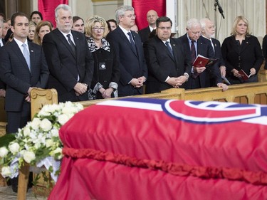 Dignitaries look on behind the casket of Jean Béliveau at funeral for the former Canadiens captain at Mary, Queen of the World Cathedral in Montreal on Dec.10, 2014.