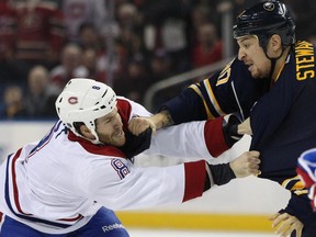 The Canadiens' Brandon Prust fights with the Sabres' Chris Stewart during game in Buffalo on Nov. 28, 2014.