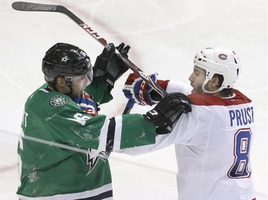 Montreal Canadiens right wing Brandon Prust (8) and Dallas Stars left wing Ryan Garbutt (16) mix it up during the second period of an NHL hockey game Saturday, Dec. 6, 2014, in Dallas.