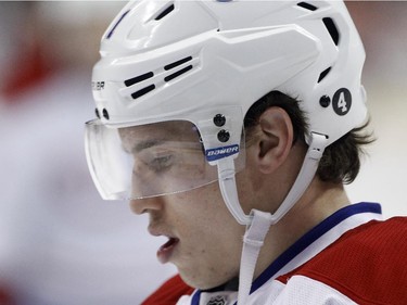 Montreal Canadiens right wing Brendan Gallagher wears a number 4 decal on his helmet in honour of hockey legend Jean Béliveau during warmups  before an NHL hockey game against the Minnesota Wild in St. Paul, Minn., Wednesday, Dec. 3, 2014. Béliveau died at the age of 83 on Tuesday.