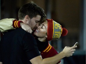 Miley Cyrus kisses Patrick Schwarzenegger seen here kissing at the game between the California Golden Bears and the USC Trojans at Los Angeles Memorial Coliseum.