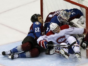 Avalanche defenceman Zach Redmond runs the Canadiens' Alex Galchenyuk into goalie Calvin Pickard during third period of Montreal's 4-3 victory in Denver on Dec. 1, 2014.