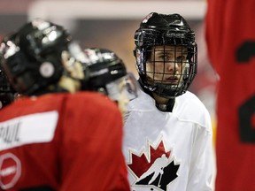 Connor McDavid takes a break during Team Canada junior practice at the Meridian Centre on Dec. 15, 2014 in St. Catharines, Ont.