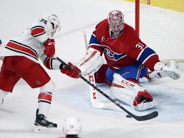 Montreal Canadiens goalie Carey Price (31) makes the save against Carolina Hurricanes left wing Chris Terry (25) during first period National Hockey League action Tuesday, December 16, 2014 in Montreal.