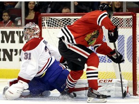 Montreal Canadiens goalie Carey Price (31) blocks a shot by Chicago Blackhawks centre Marcus Kruger (16) during the second period of an NHL hockey game in Chicago, Friday, Dec. 5, 2014.