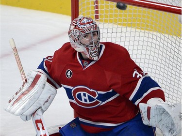 Montreal Canadiens goalie Carey Price (31) keeps his eyes on the puck against the Carolina Hurricanes during third period National Hockey League action Tuesday, December 16, 2014 in Montreal.