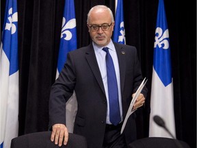 Quebec Finance Minister Carlos Leitao presents an economic update Tuesday, December 2, 2014 at the legislature in Quebec City.