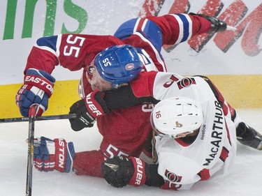 Montreal Canadiens' Sergei Gonchar collides with Ottawa Senators Clarke MacArthur during second period NHL hockey action in Montreal, Saturday, December 20, 2014.