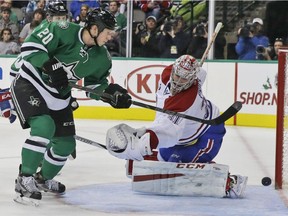 Dallas Stars centre Cody Eakin (20) scores a goal against Montreal Canadiens goalie Carey Price (31) during the first period of an NHL hockey game Saturday, Dec. 6, 2014, in Dallas.