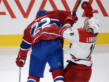 Montreal Canadiens right wing Dale Weise (22) runs into Carolina Hurricanes centre Elias Lindholm (16) during second period National Hockey League action Tuesday, December 16, 2014 in Montreal.