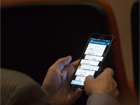 A man uses his cell phone to exchange text messages on Tuesday, Nov. 18, 2014.