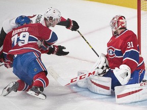 Ottawa Senators' Erik Condra, centre, scores against Montreal Canadiens goaltender Carey Price as Canadiens' Andrei Markov (79) defends during first period NHL hockey action in Montreal, Saturday, December 20, 2014.