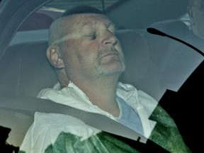 Richard Henry Bain, seen in the back of a police car in September 2012.