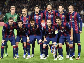 Barcelona players pose for team photo before UEFA Champions League game against Paris Saint-Germain at the Camp Nou stadium in Barcelona on Dec. 10, 2014.