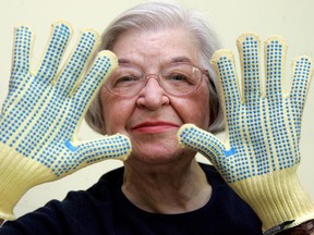 Stephanie Kwolek, shown in this June 20, 2007 file photo taken in Brandywine Hundred, Del.,  wears regular house gloves made with the Kevlar she invented.