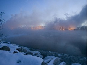 Fog and smoke rise from the Ottawa River and Tembec's pulp mill Thursday February 28, 2008 in Témiscaming, Que.