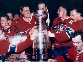 Canadiens coach Toe Blake puts his hand on Jean Béliveau's head while Yvan Cournoyer (12) and teammates celebrate after winning the Stanley Cup in 1965.