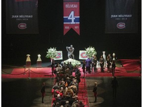 Mourners line up to pay their respects to Jean Beliveau during the visitation at the Bell Centre Monday, December 8, 2014 in Montreal. The Montreal Canadiens hockey legend passed away Tuesday, Dec. 2, 2014 at the age of 83.THE CANADIAN PRESS/Ryan Remiorz