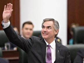 Alberta Premier Jim Prentice waves to the gallery before the speech from the throne at the Alberta Legislature in Edmonton, on Monday November 17, 2014.