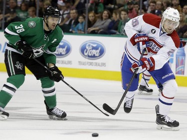 Montreal Canadiens left wing Jiri Sekac (26) and Dallas Stars centre Vernon Fiddler (38) skate for the puck during the first period of an NHL hockey game Saturday, Dec. 6, 2014, in Dallas.
