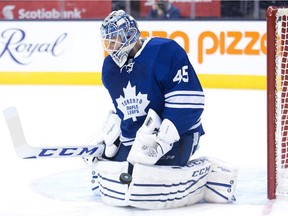 Maple Leafs goalie Jonathan Bernier makes a save against the Vancouver Canucks during game in Toronto on Dec. 6, 2014.