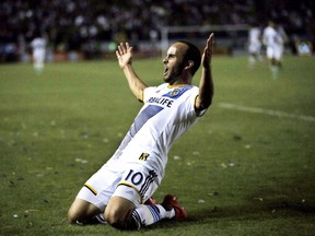 The Los Angeles Galaxy's Landon Donovan celebrates after scoring a goal against Real Salt Lake during MLS Western Conference playoff game, in Carson, Calif.