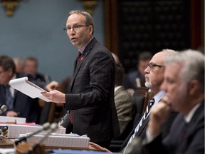 Quebec Treasury board president Martin Coiteux tables legislation, Oct. 9, 2014 at the legislature in Quebec City.