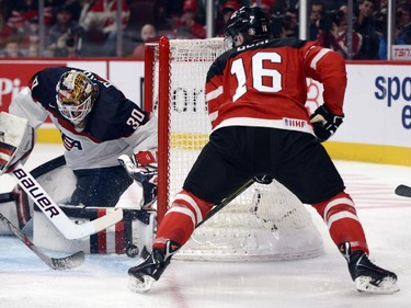 Canada's Max Domi is stopped by USA's goaltender Thatcher Demko during first period preliminary round hockey action at the IIHF World Junior Championship, Wednesday, December 31, 2014 in Montreal.THE CANADIAN PRESS/Ryan Remiorz