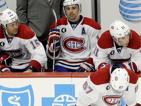 Montreal Canadiens  players react  after Chicago Blackhawks left wing Brandon Saad (20) scored a goal during the third period of an NHL hockey game in Chicago, Friday, Dec. 5, 2014. The Blackhawks won 4-3.