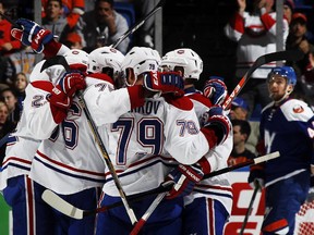 The Canadiens' Andrei Markov (No. 79) celebrates with teammates after scoring goal against the New York Islanders at Nassau Veterans Memorial Coliseum on Dec. 23, 2014.