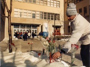 George Chidiac, 26, places flowers at Ecole Polytechnique Dec. 8, 1989.