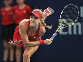 Eugenie Bouchard follows through on a serve during match against American Shelby Rogers at the Rogers Cup tennis tournament in Montreal on Aug. 5, 2014.