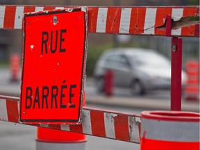 MONTREAL, QUE: AUGUST 21, 2011 - Road construction on Dorval Ave and l'Eglise in the City of Dorval at 3:12 PM on Sunday, August 21, 2011.  NATURE OF THE WORK (construction and refurbishing work on the water mains along Dorval, Dawson and Lilas avenues. START/END DATE Work began August 8 and all the work is expected to finish at the end of November. 1. Construction of a 200-mm secondary water main on Dorval Avenue, between Carson and Dawson. 2. Refurbishing by inserting a structural lining inside the 500-mm water main. (Dave Sidaway / THE GAZETTE) ORG XMIT: POS2013011015284138