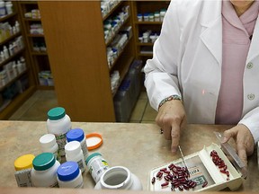 Pharmacist Murielle Cadieux works out prescriptions at the Proxim Pharmacy in Westmount on Tuesday December 01, 2009.