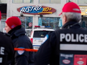 Montreal police secure the area around the Bistro XO Plus in Montreal on Monday December 1, 2014. The Bistro was the site of a mafia related assassination that ended the 12 months of relative calm following the death of reputed mafia boss Vito Rizzuto.  (Allen McInnis / MONTREAL GAZETTE)