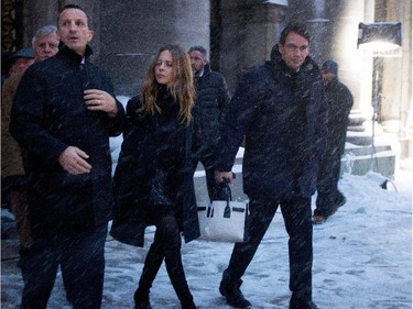 Former Montreal Canadiens Guy Carbonneau, left to right, Julie Snyder and Pierre Karl Péladeau leave Mary Queen of the World Cathedral after the funeral for Montreal Canadiens legend Jean Béliveau in Montreal on Wednesday December 10, 2014.