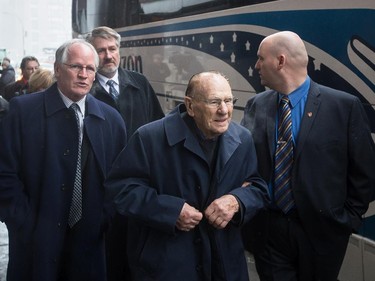 Former Toronto Maple Leafs goalie and hockey great Johnny Bower, centre, leaves the Bell Centre for the funeral of Montreal Canadiens great Jean Béliveau held at the Mary Queen of the World Cathedral in Montreal on Wednesday, December 10, 2014.