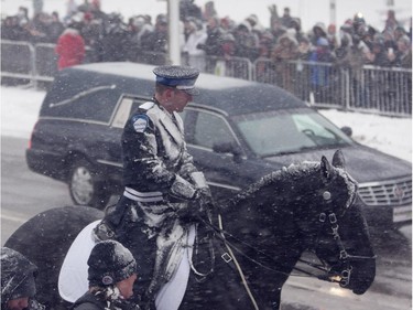 The hearse arrives for the funeral of Montreal Canadiens hockey great Jean Béliveau at Mary Queen of the World Cathedral in Montreal, December 10, 2014.