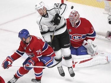 Los Angeles Kings Trevor Lewis screens Montreal Canadiens goalie Carey Price as Jake Muzzin's finds the net during second period of National Hockey League game in Montreal Friday December 12, 2014. Canadiens defenceman Andrei Markov defends in the foreground.