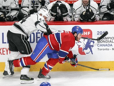 Montreal Canadiens Brandon Prust is hit from behind by Los Angeles Kings Robyn Regehr during first period of National Hockey League game in Montreal Friday December 12, 2014.