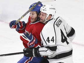 Montreal Canadiens Brandon Prust jostles with Los Angeles Kings Robyn Regehr during second period of a National Hockey League game in Montreal Friday December 12, 2014.