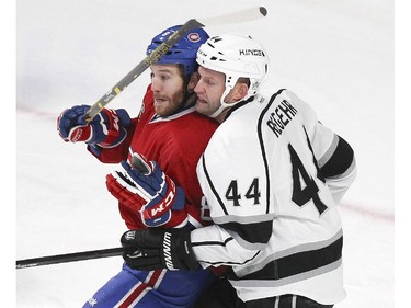 Montreal Canadiens Brandon Prust jostles with Los Angeles Kings Robyn Regehr during second period of National Hockey League game in Montreal Friday December 12, 2014.
