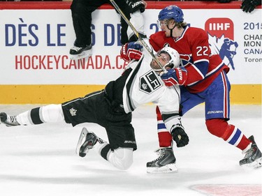 Montreal Canadiens Dale Wiese drags down Los Angeles Kings Alec Martinez during second period of a National Hockey League game in Montreal, Friday December 12, 2014.