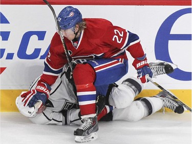 Montreal Canadiens Dale Wiese pushes Los Angeles Kings Jake Muzzin's head to the ice during second period of National Hockey League game in Montreal Friday December 12, 2014.