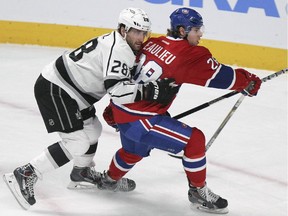 Canadiens defenceman Nathan Beaulieu, right, holds off Los Angeles Kings Jarret Stoll during the first period of National Hockey League game in Montreal on Friday, December 12, 2014.