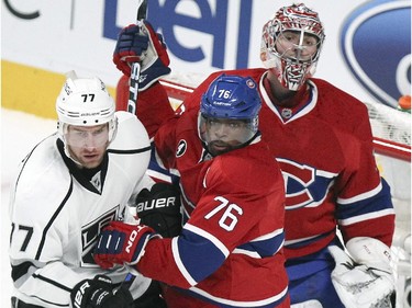 Montreal Canadiens goalie Carey Price tries to follow the puck as teammate P.K. Subban jostles with Los Angeles Kings Jeff Carter  during the first period of a National Hockey League game in Montreal Friday December 12, 2014.