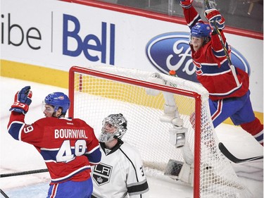 Montreal Canadiens Michael Bournival and Manny Malhotra celebrate teammate Andrei Markov's goal against Los Angeles Kings goalie Martin Jones during second period of a National Hockey League game in Montreal Friday December 12, 2014.